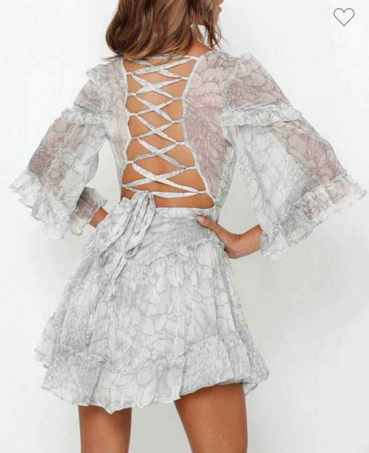 Beverly Bell sleeved Printed chiffon mini dress with criss cross back.